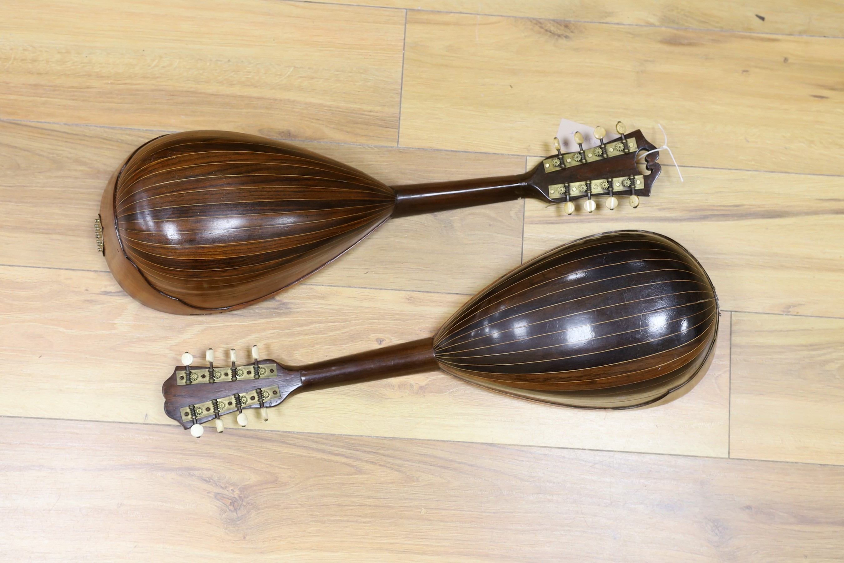 Two mandolins, with mother of pearl and tortoiseshell inlay, 57ms long, bone mounts